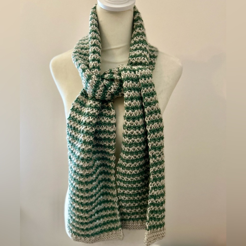 Hand knit cream and green scarf, in a 2 color moss stitch. Yarn is a wool blend.